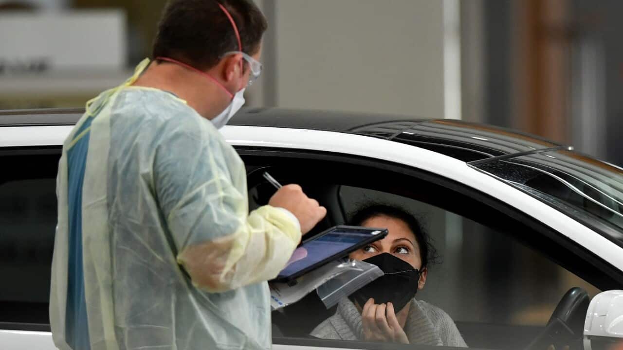 Members of the public are tested for COVID-19 at a drive-though testing centre in Melbourne