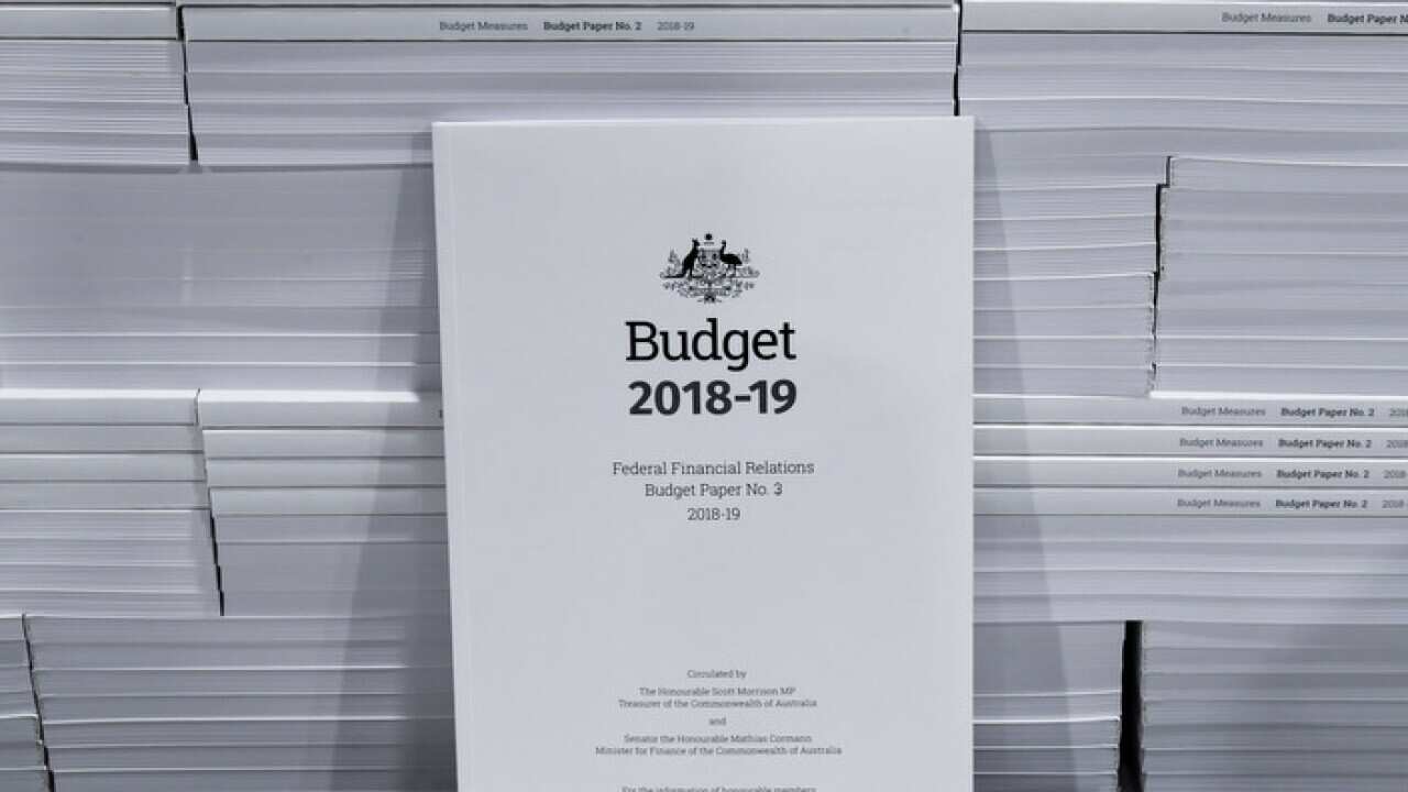 The cover of the 2018-19 Budget papers is seen at Canprint in Canberra, Sunday, May 6, 2018. Australia's Treasurer Scott Morrison will deliver his third Budget on Tuesday, May 8. (AAP Image/Lukas Coch) NO ARCHIVING