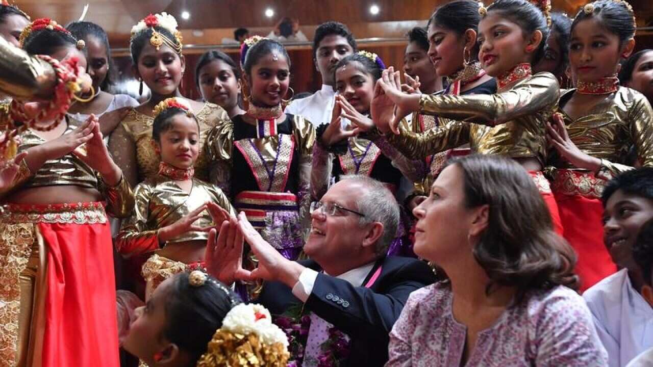 Scott and Jenny Morrison visit a Sri Lankan temple in Melbourne.