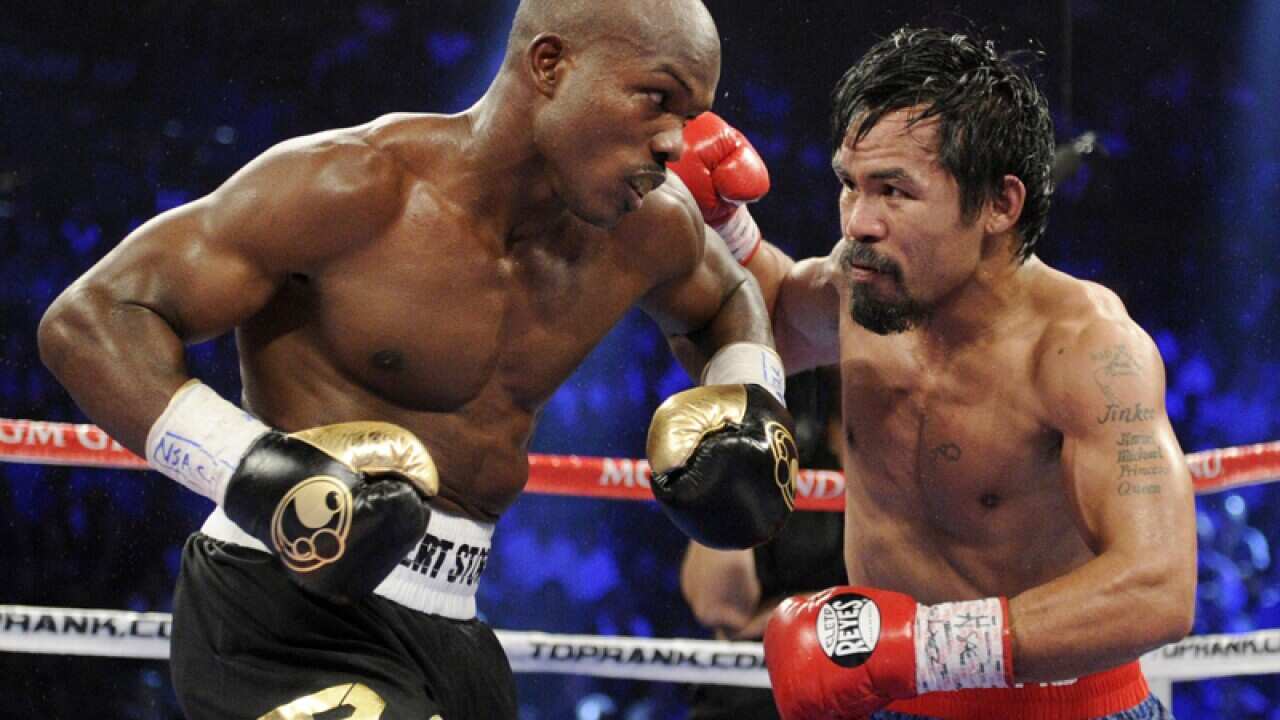 Manny Pacquiao, right, and Timothy Bradley face off