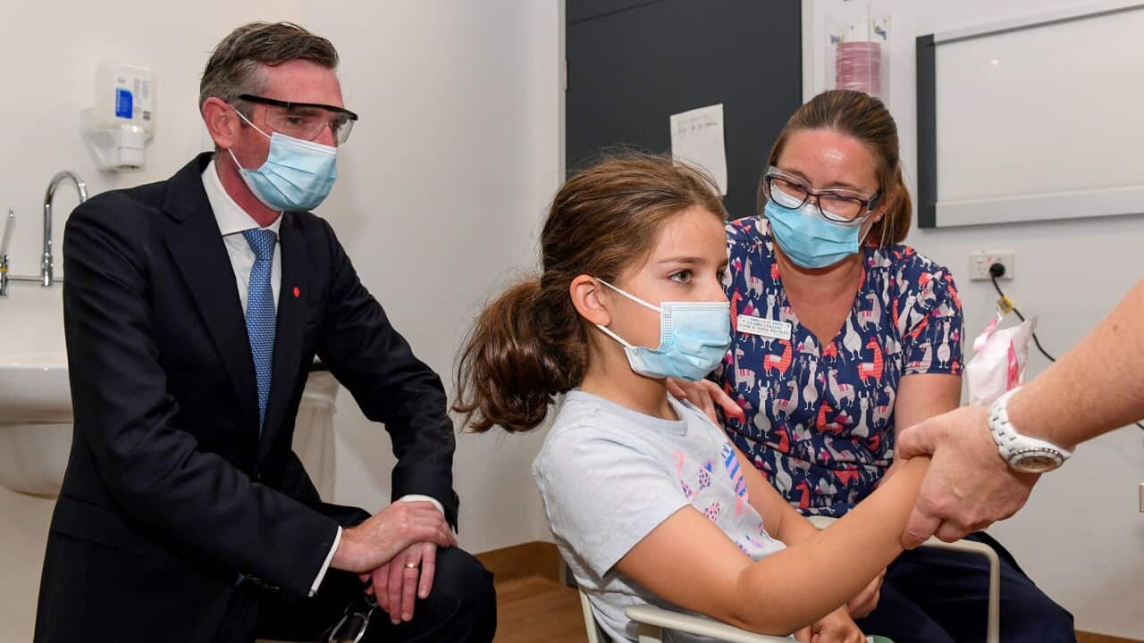 An eight-year old has her first dose in Sydney