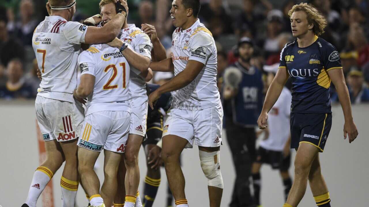 Damien McKenzie of the Chiefs celebrates with team mates