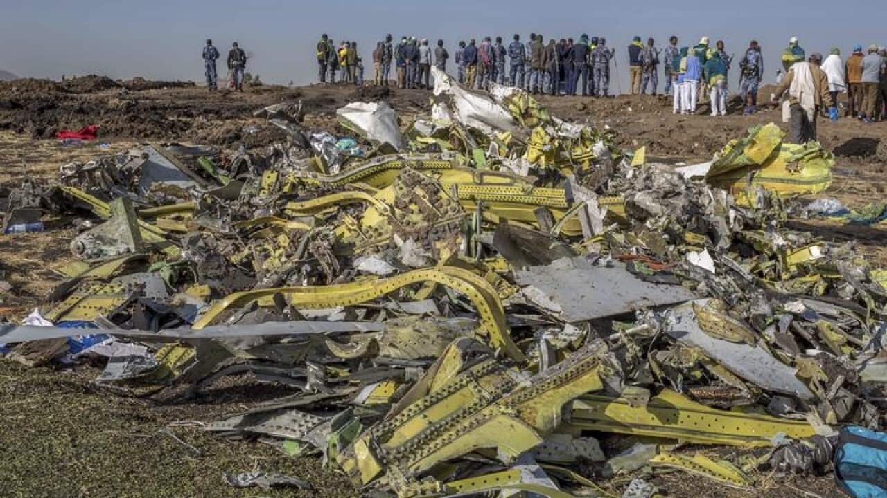 Wreckage is piled at the crash scene