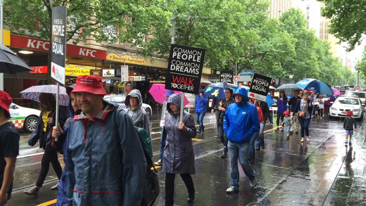 Several hundred people march through central Melbourne