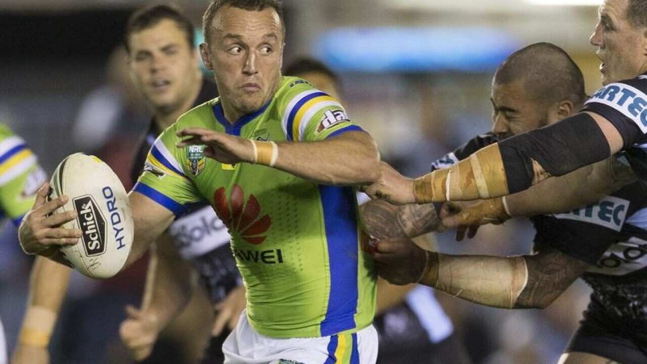 Josh Hodgson of the Raiders makes a break during the Round 22.