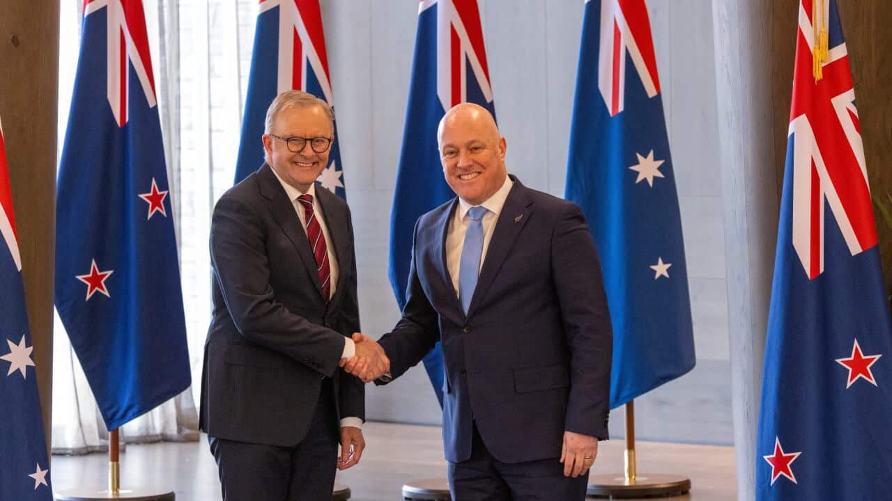 Two men in suits shaking hands