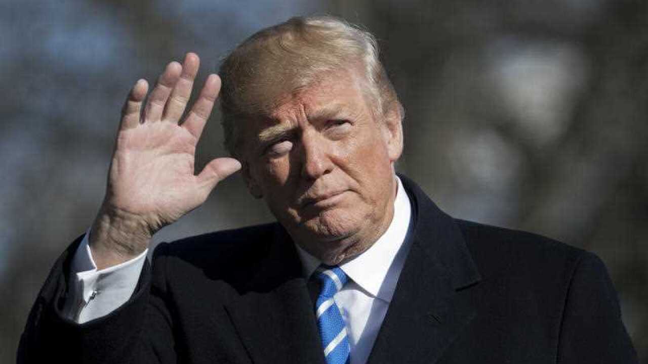 President Donald Trump waves as he arrives back at the White House in Washington, Thursday, April 5, 2018.