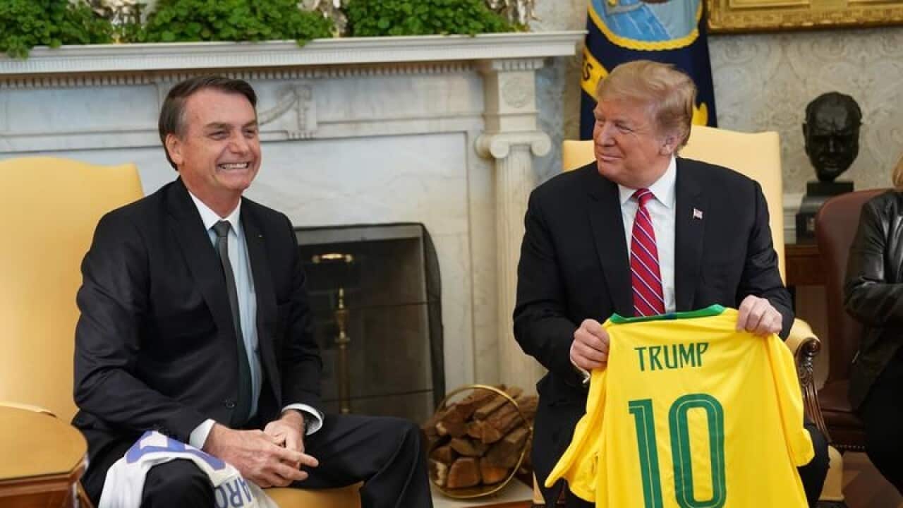 Jair Bolsonaro and Donald Trump exchange soccer jerseys