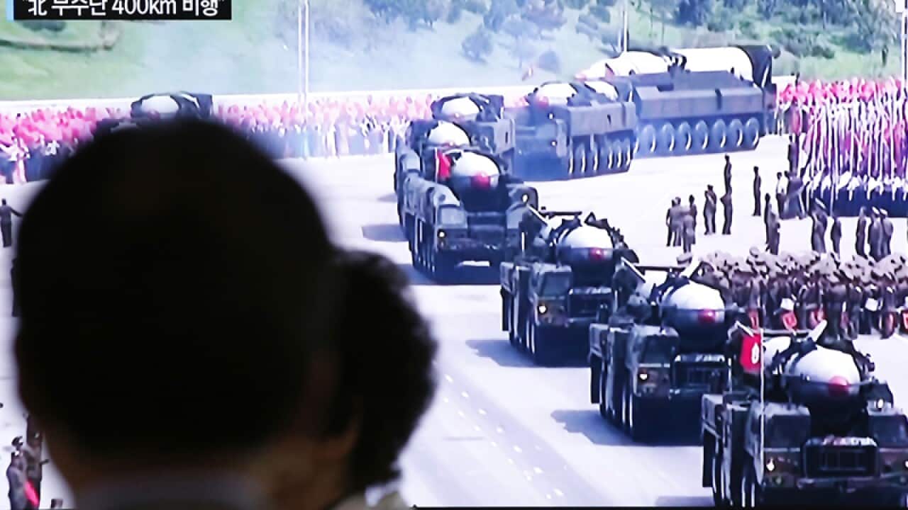 A TV news program reporting on a missile launch in North Korea