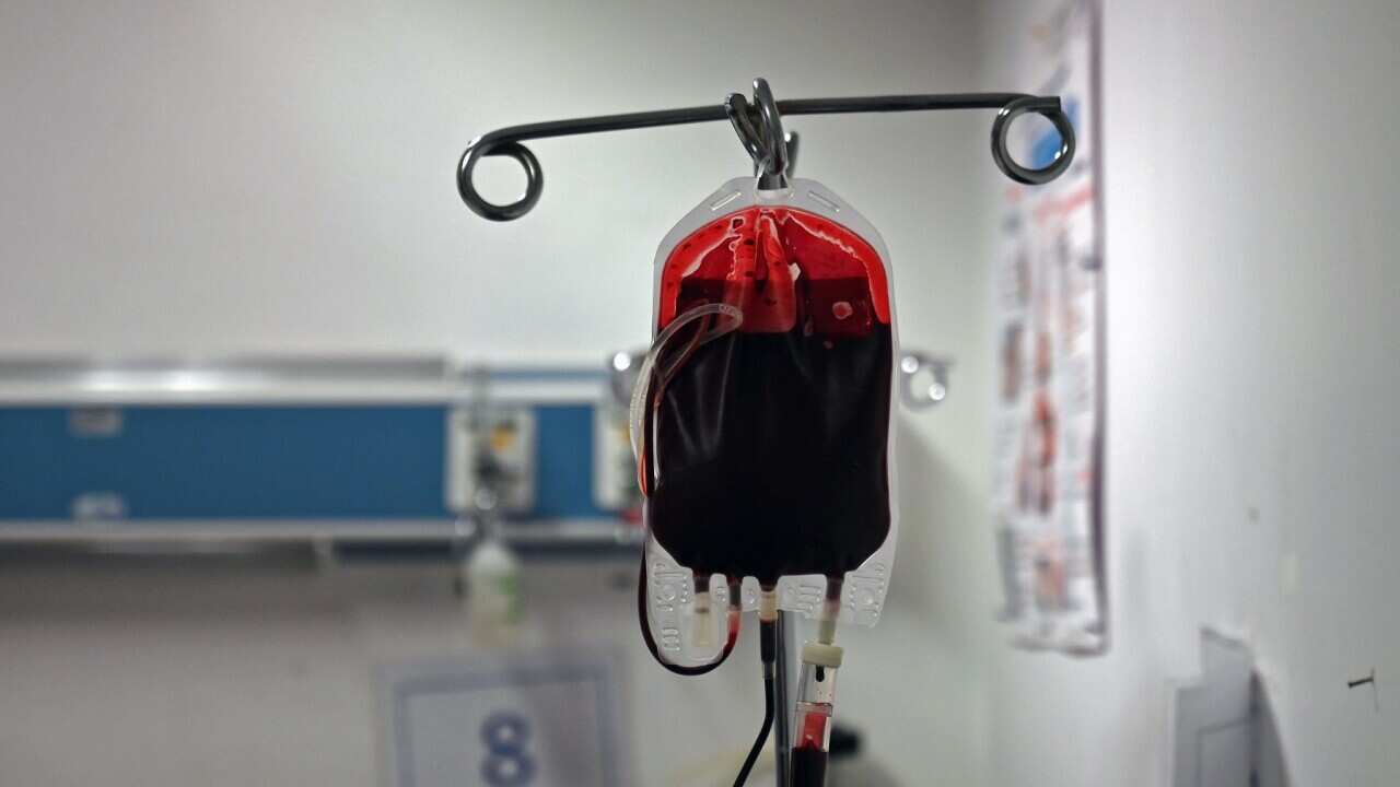 A cancer patient receives a blood transfusion
