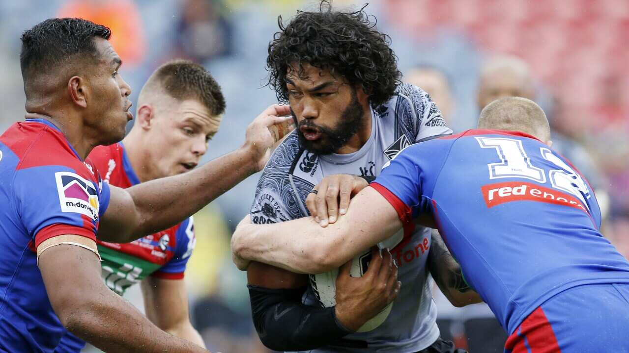 Adam Blair of the Warriors is tackled by Mitchell Barnett during the Round One NRL match between Newcastle Knights and New Zealand Warriors, 14 March, 2020.