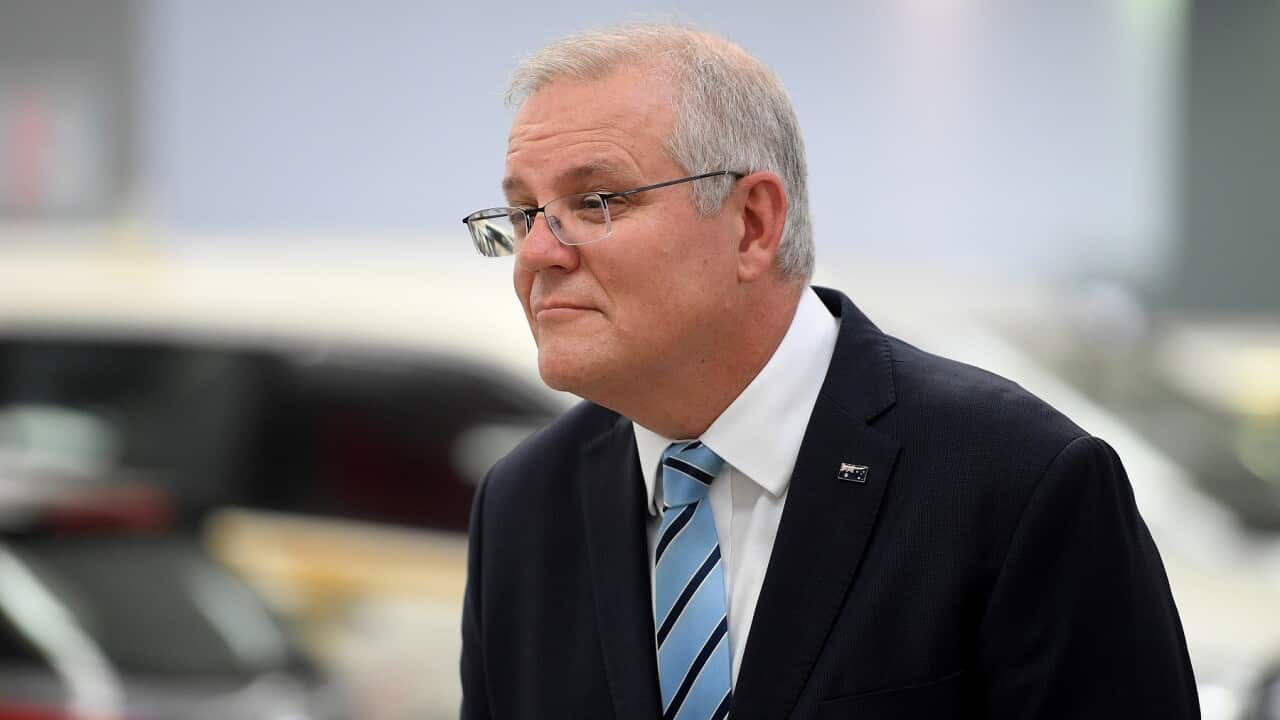 Australian Prime Minister Scott Morrison speaks to media during a visit to the Phil Gilbert Motor Group car delalership in Sydney, Friday, March 12, 2021. (AAP Image/Dan Himbrechts) NO ARCHIVING