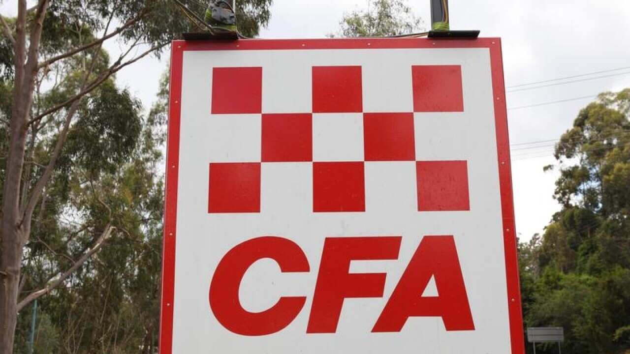 A Country Fire Authority (CFA) sign by a road.