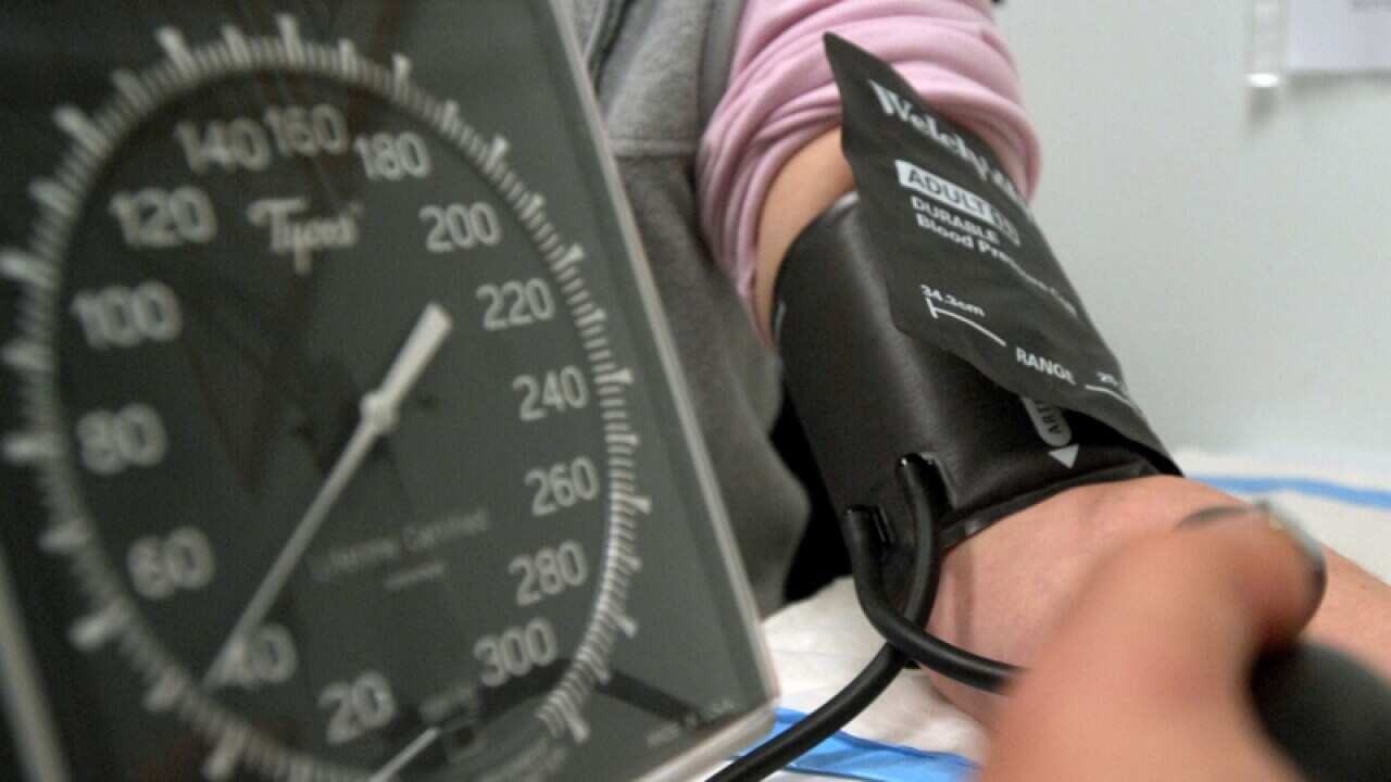 A patient has their blood pressure taken.