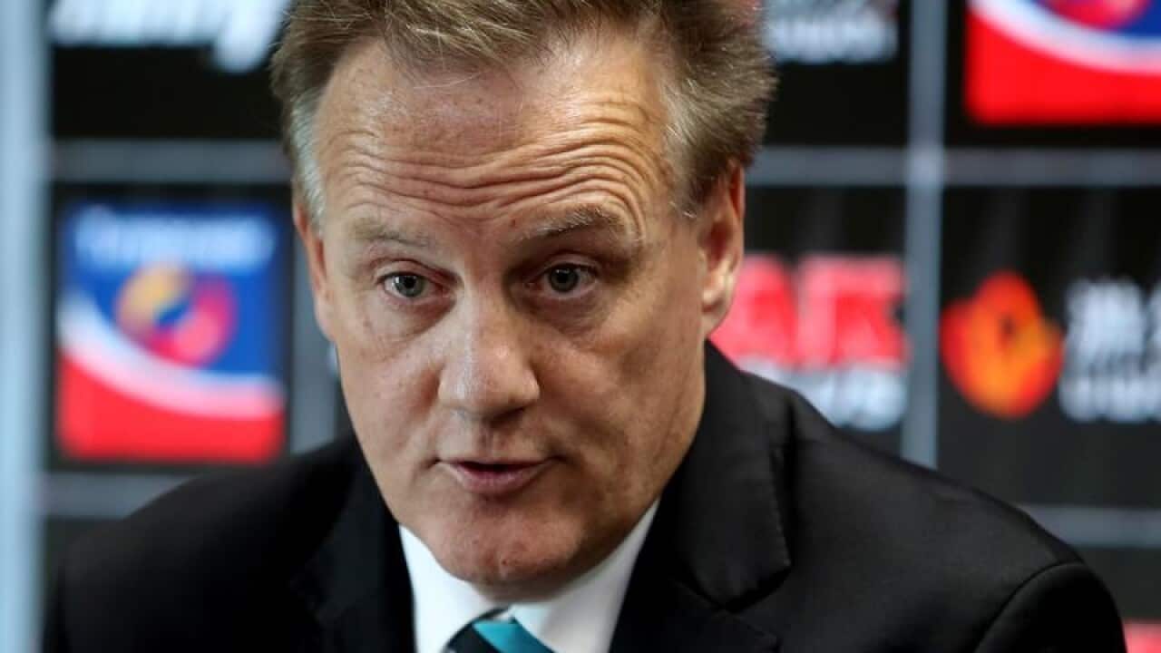 Port Adelaide CEO Keith Thomas speaks at a press conference.