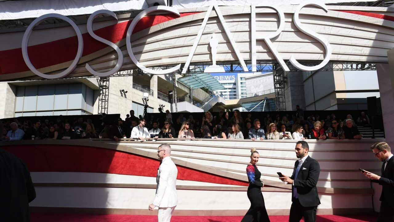 Media walk on the red carpet before the Oscars on Sunday, Feb. 24, 2019, at the Dolby Theatre in Los Angeles.