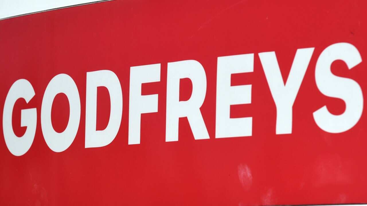 A sign bearing the Godfrey's logo