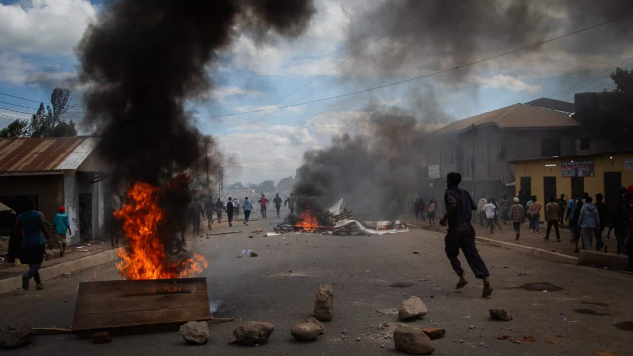 People protest in the streets of Arusha, Tanzania