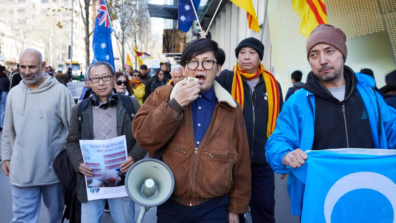 Pro-democracy demonstrators march during a rally supporting the Hong Kong democracy movement at the Victorian State Library in Melbourne.