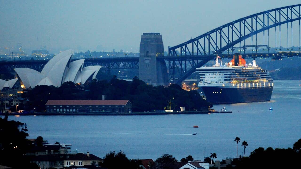 Queen Mary 2 sailing past the Opera House in 2009.