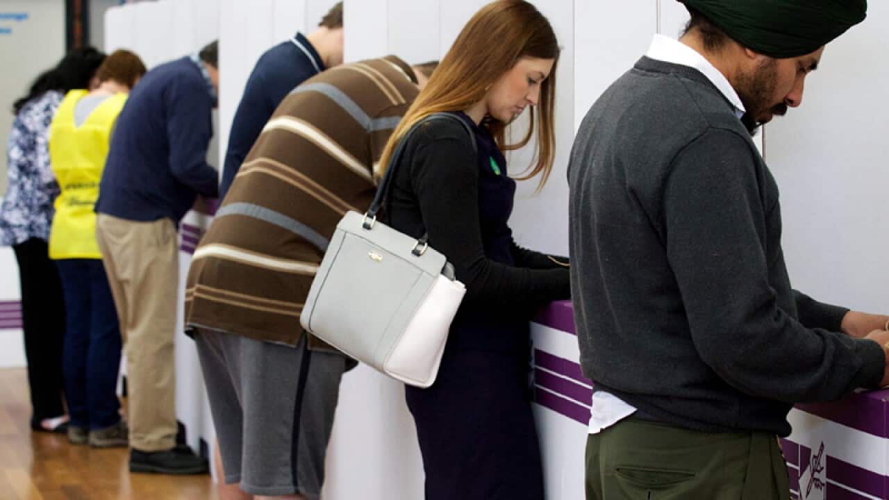 Members of the public casting their vote at Kelmscott High School