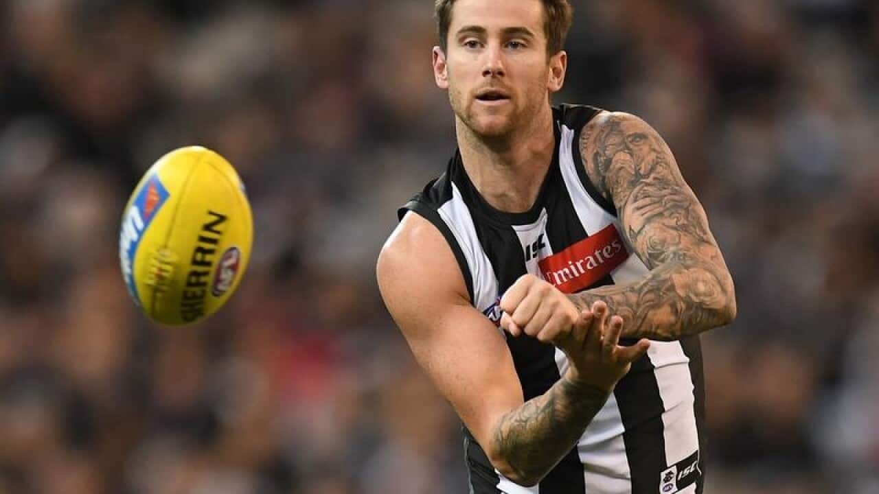 File image of Jeremy Howe of the Magpies punting the ball.