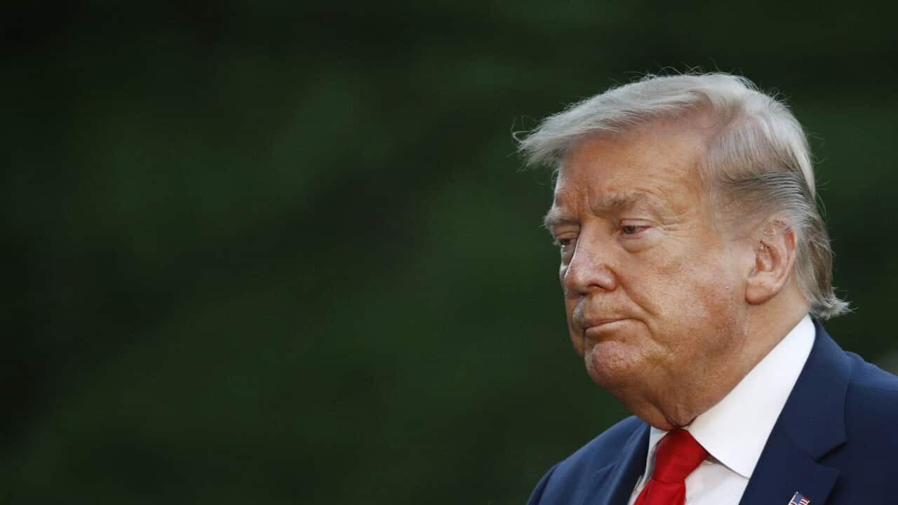 In this Saturday, May 30, 2020, photo, President Donald Trump walks across the South Lawn of the White House in Washington