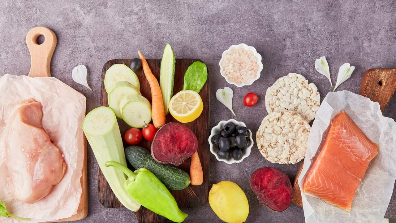 Aesthetics vegetables, chicken fillet, olives, salmon and greens top view. Keto, Paleo, Low carb, FODMAP diet concept