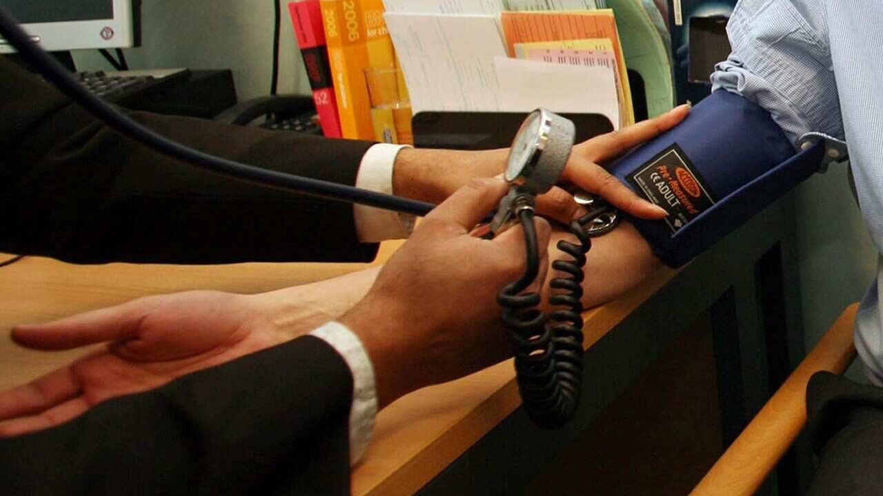 A man having his blood pressure taken