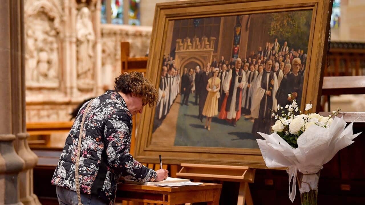 Members of the public leave messages of condolences for Queen Elizabeth II at St. Andrew's Cathedral in Sydney