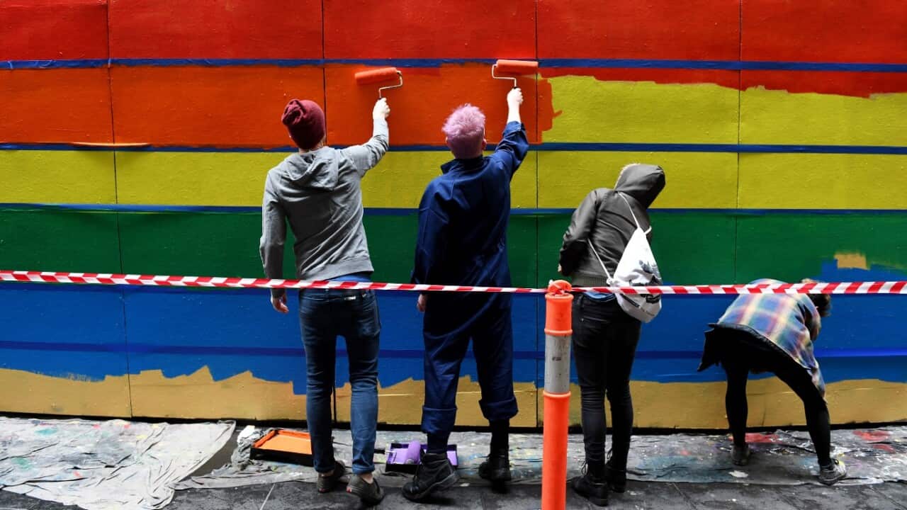 The Apparition team paint a pro-gay marriage mural at Knox Lane in Melbourne, Sunday, August 27, 2017.