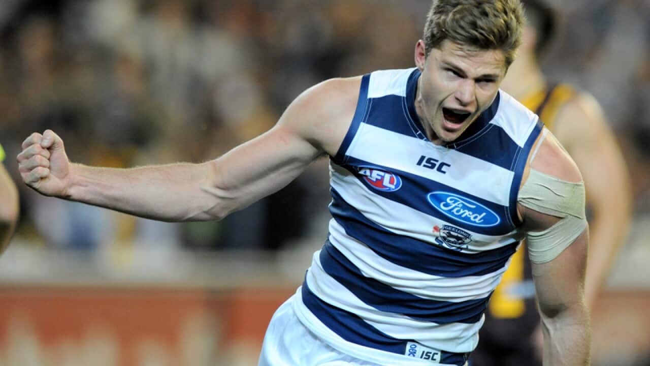 Nathan Vardy of Geelong celebrates after kicking a goal