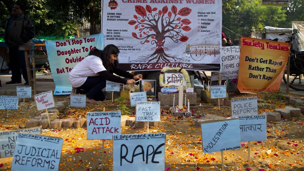 A woman pays respect on the second anniversary of the deadly gang rape of a student on a bus in New Delhi. The case sparked public outrage and helped make women’s safety a common topic of conversation