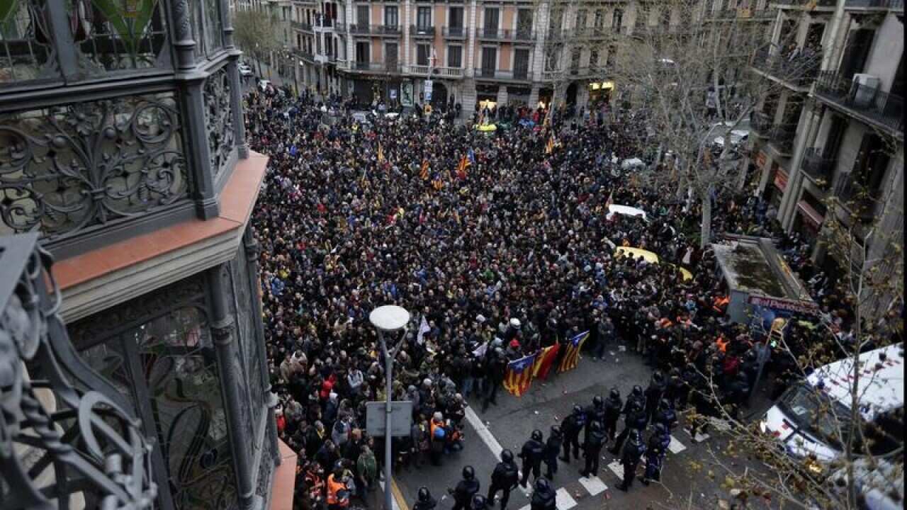 Police hold back demonstrators in Barcelona