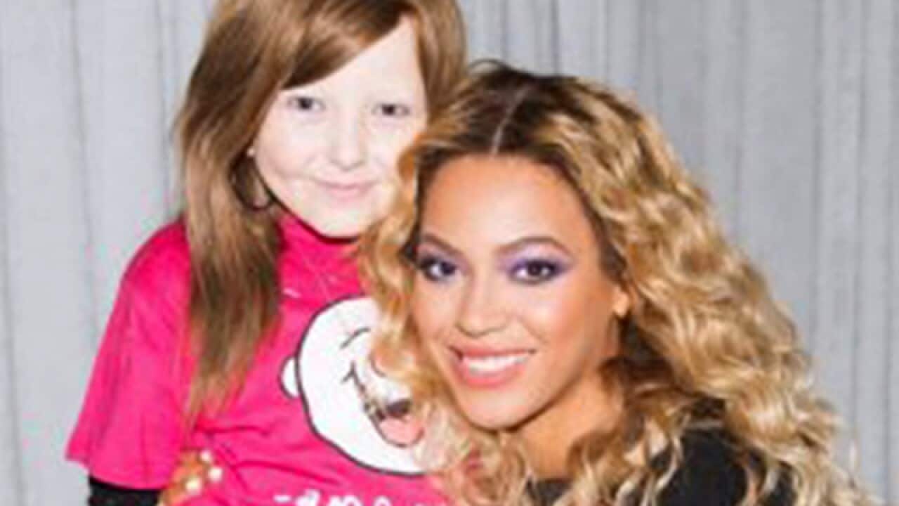 Singer Beyonce (R) and cancer patient Chelsea Lee James