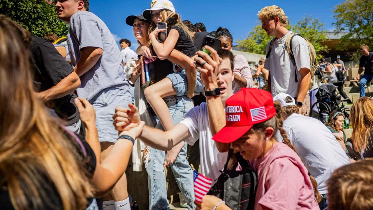 The crowd reacts after Charlie Kirk is shot and killed at a University event (AAP)
