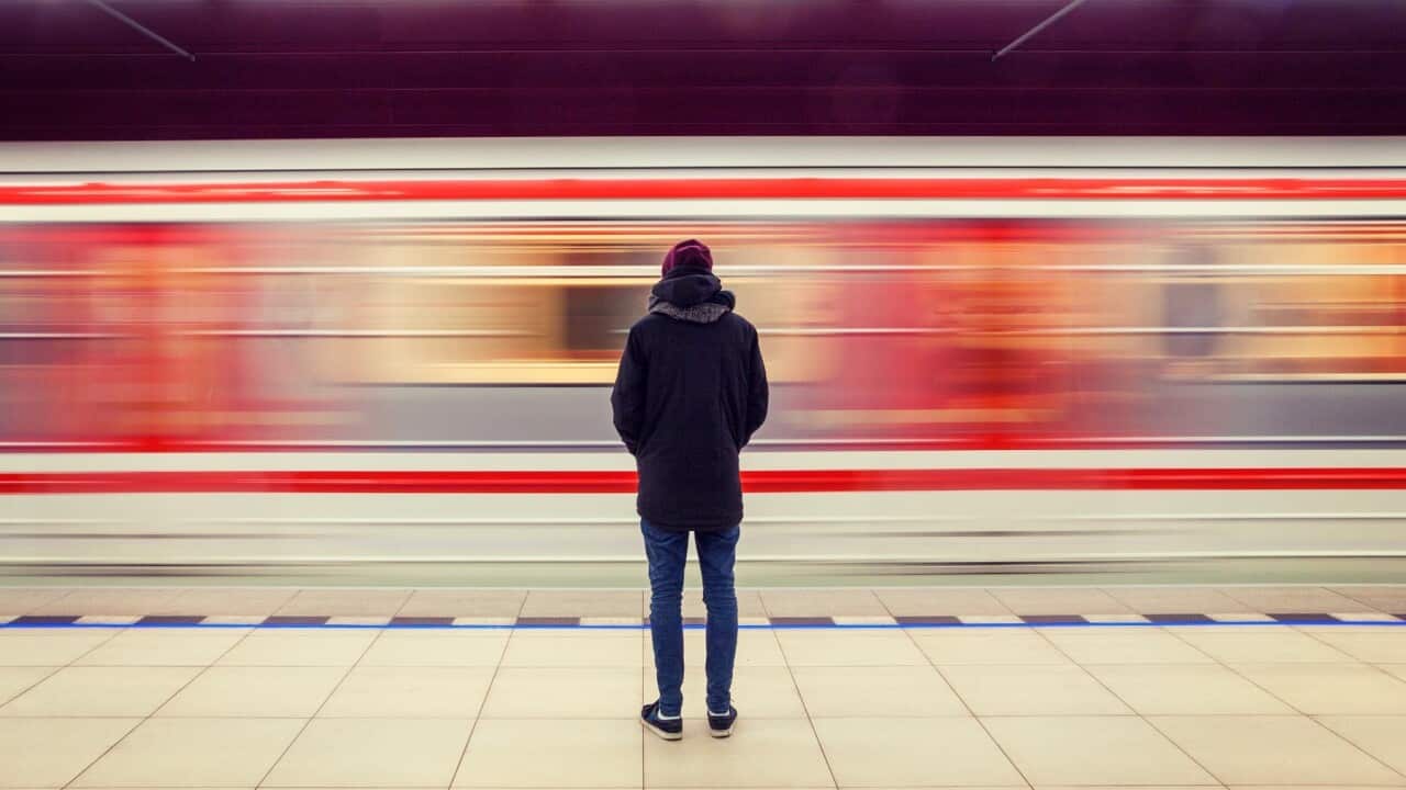 Man alone at train station