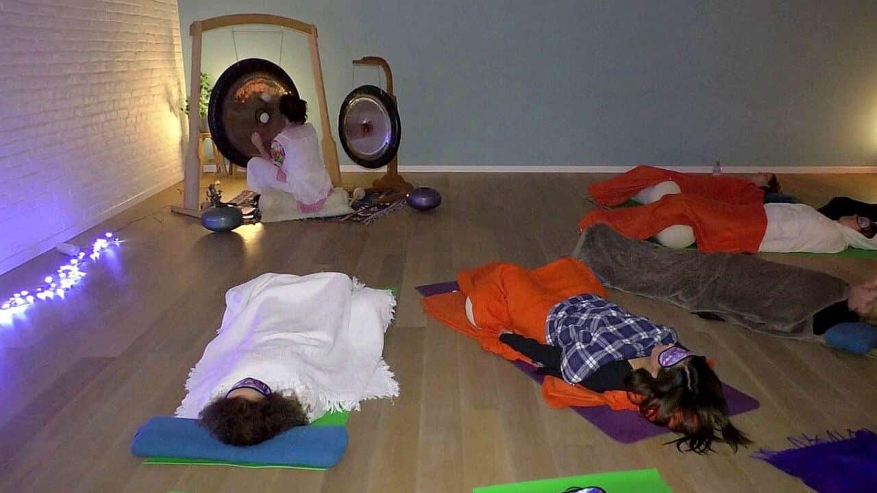 Fiona Crossley running a 'gong bath' session in Brussels