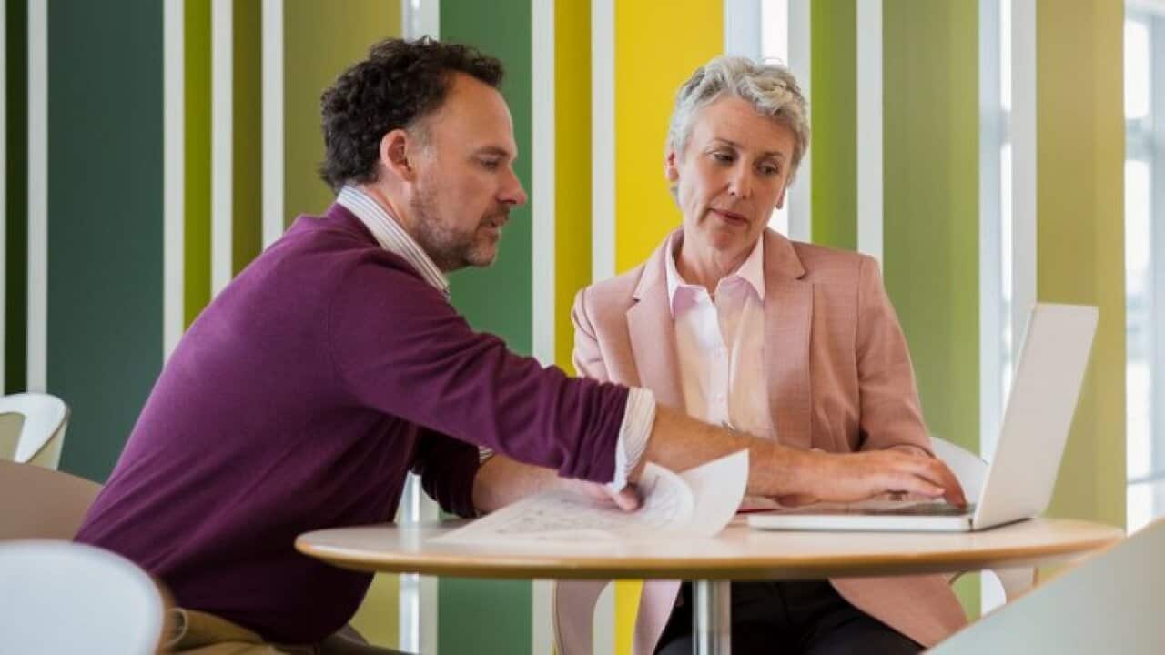 Business people discussing plans in cafe