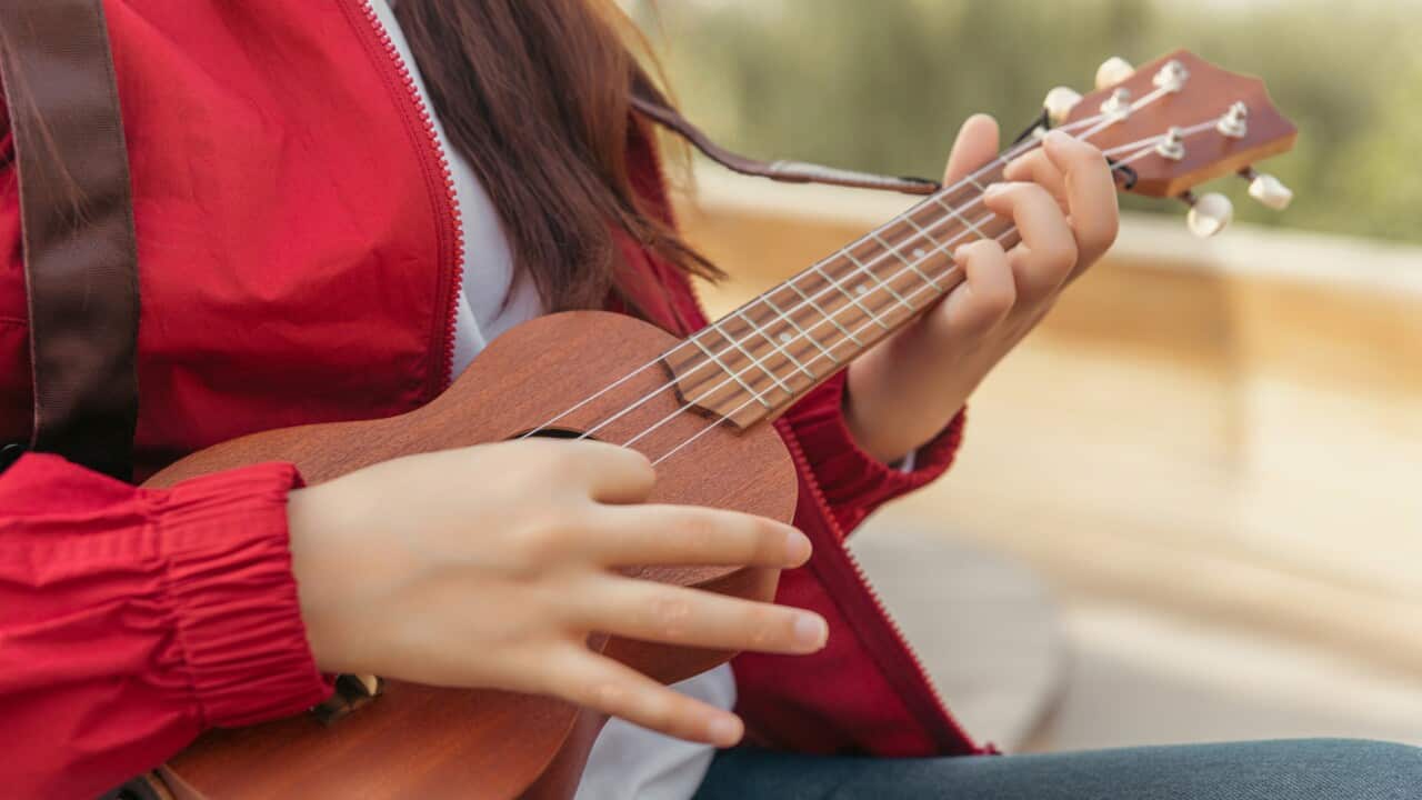 Autumn portrait of happy girl resting in park