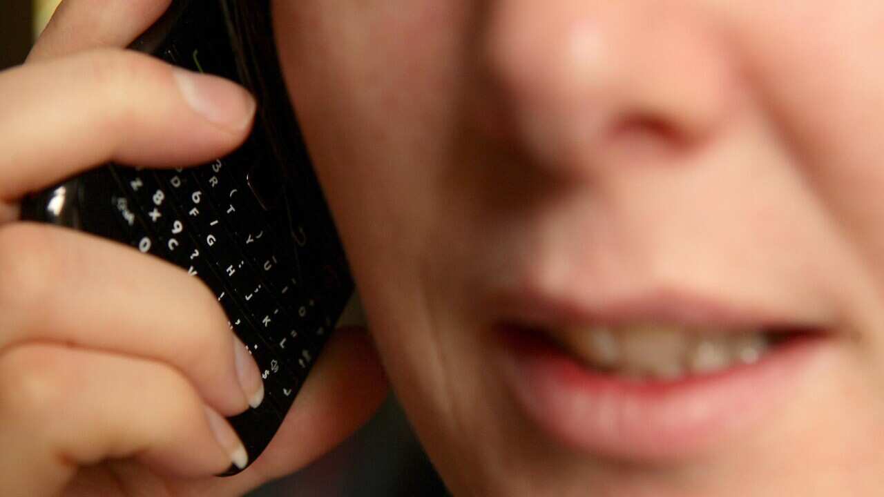 File photo of a woman talking on a mobile phone.