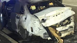 A burnt grey corolla.