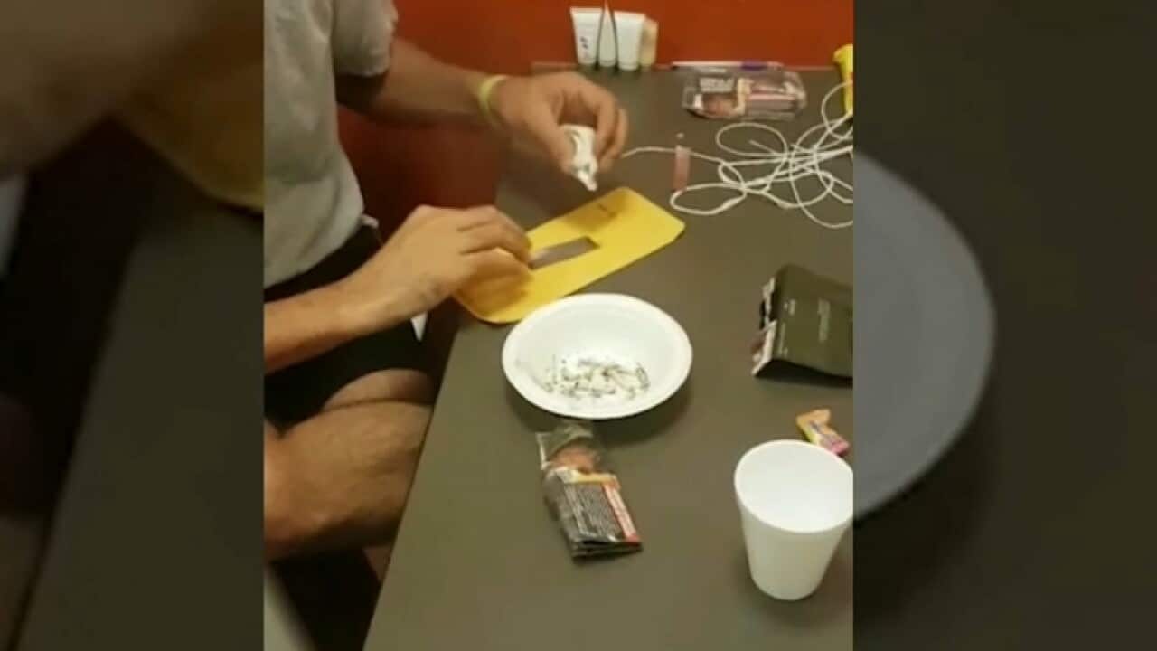 A detainee inside Villawood using drug paraphernalia (Supplied)