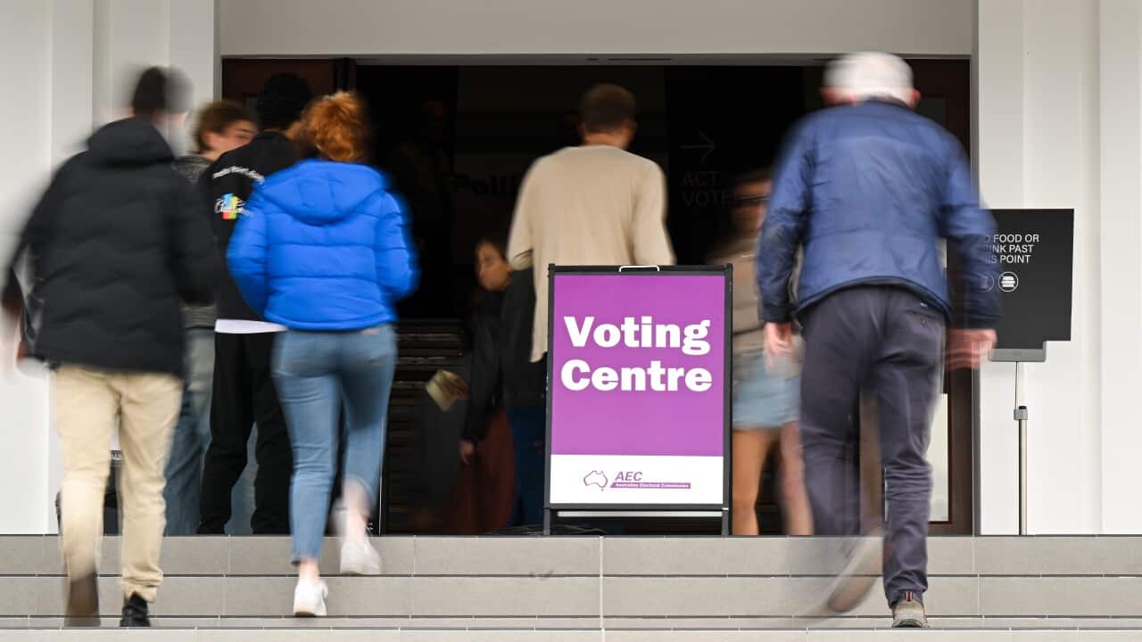 People walk into the voting centre at Old Parliament House in Canberra