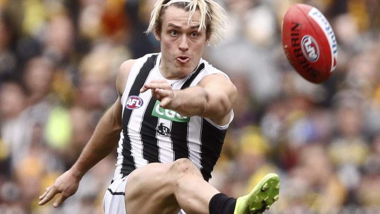 File image of Darcy Moore of the Magpies kicking the ball.