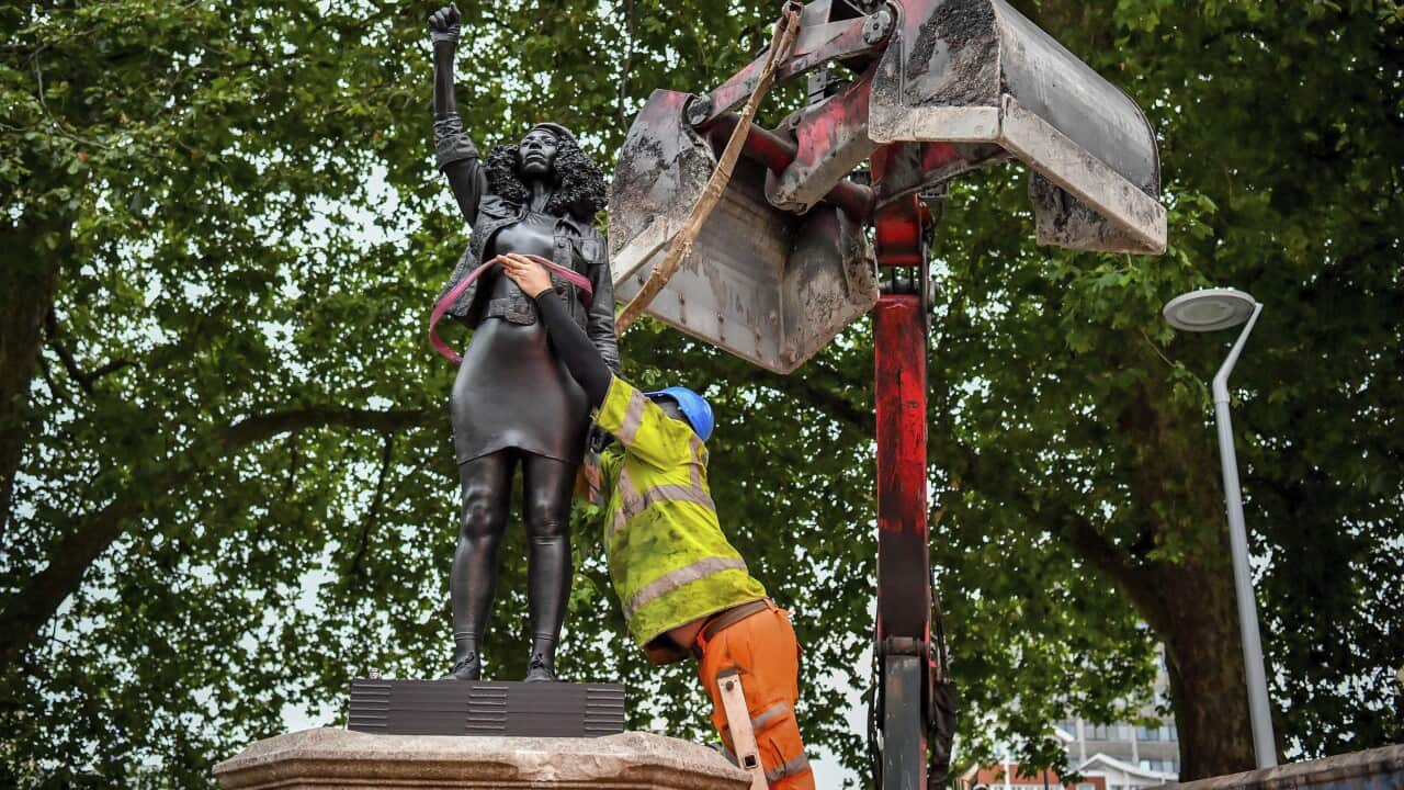 Contractors use ropes to remove A Surge of Power.