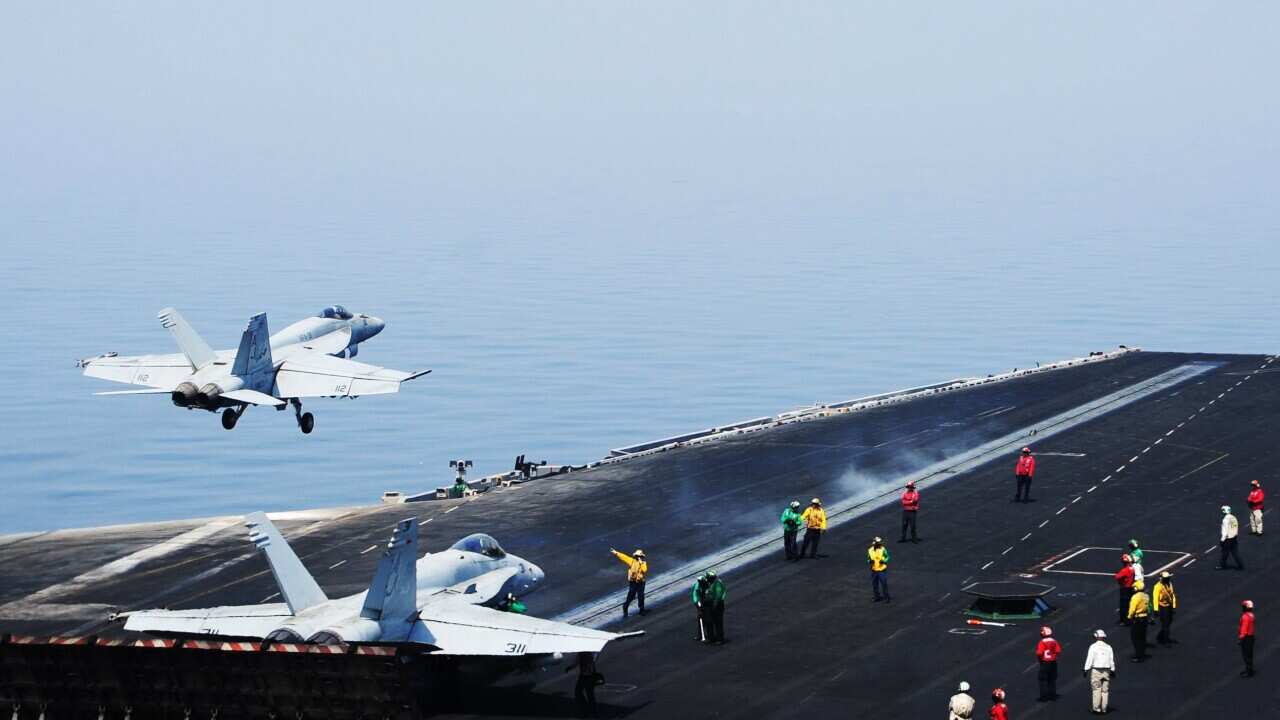 F/A-18E Super Hornet attached to the Tomcatters of Strike Fighter Squadron (VFA) 31 takes off 