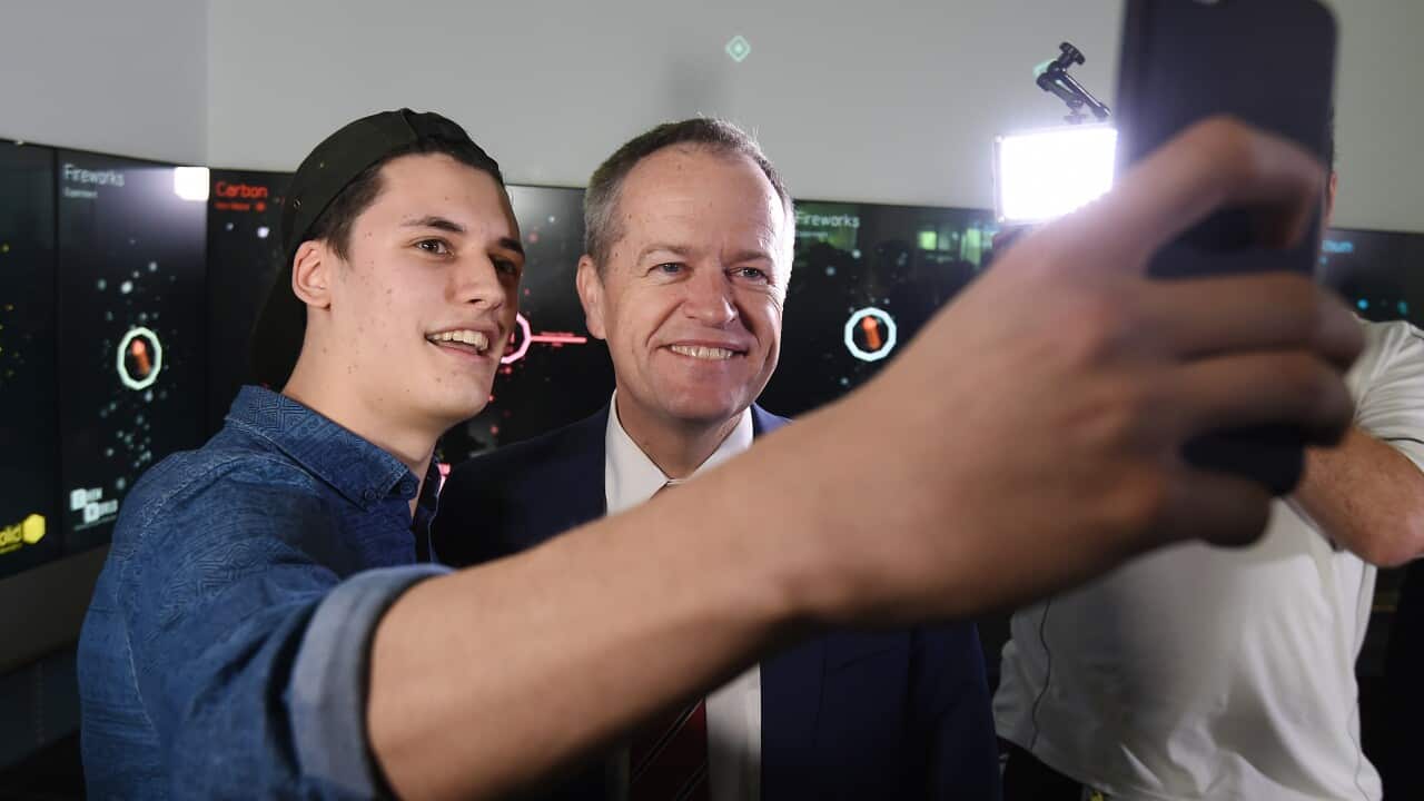 Bill Shorten poses for a selfie with a student at Queensland University of Technology.
