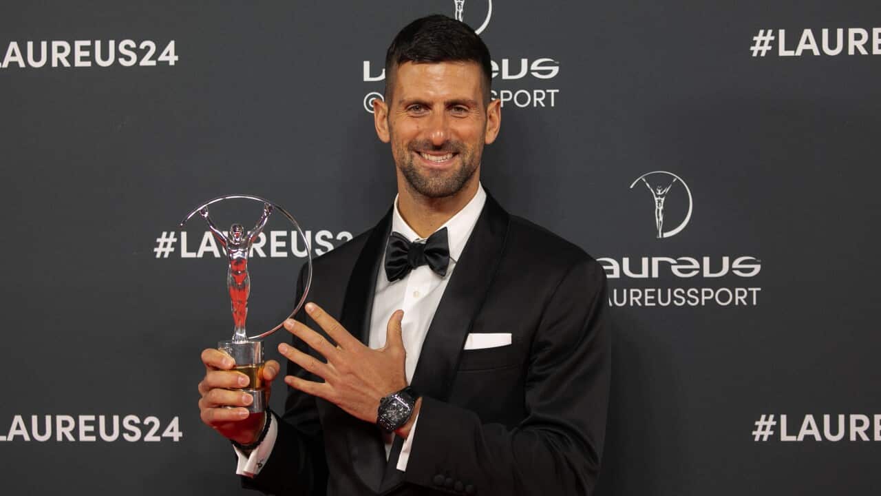 Novak Djokovic poses with the Laureus World Sportsman of the Year Award for 2023 at Galera De Cristal in Madrid