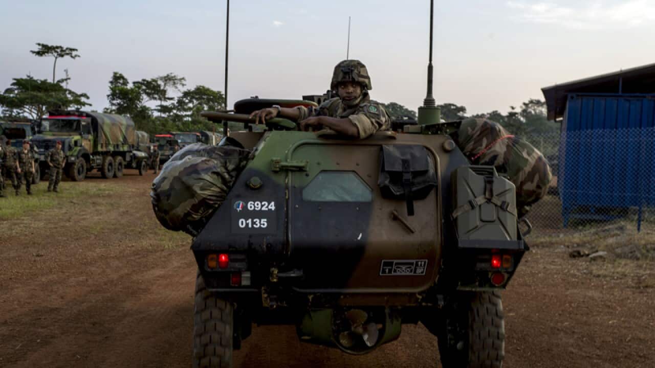 A French soldier sits in an armoured vehicle in Cameroon